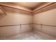 Walk-in closet with built in shelving and rods for optimal organization and storage at 16927 E Trojan Ct, Fountain Hills, AZ 85268
