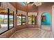 Bright dining area with neutral tile floors, windows, and access to a pool and patio at 16927 E Trojan Ct, Fountain Hills, AZ 85268