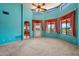 Bright living room featuring neutral carpeting, high ceilings, and a view of the patio at 16927 E Trojan Ct, Fountain Hills, AZ 85268