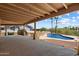 Expansive covered patio overlooking the pool and desert landscape, perfect for relaxing and entertaining at 16927 E Trojan Ct, Fountain Hills, AZ 85268