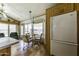 Bright dining area with a table set by the window, next to the white refrigerator at 17200 W Bell Rd # 812, Surprise, AZ 85374