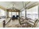 Bright and airy living area with a dining set, comfortable seating, and plenty of natural light at 17200 W Bell Rd # 812, Surprise, AZ 85374