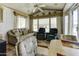 Bright living space featuring comfortable seating, a ceiling fan, and ample natural light, perfect for relaxing at 17200 W Bell Rd # 812, Surprise, AZ 85374
