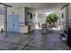 Covered outdoor patio with seating, storage, and a blue accent door, perfect for relaxing and entertaining at 17200 W Bell Rd # 812, Surprise, AZ 85374