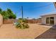 This shot of the backyard shows the xeriscaping and the patio with sliding glass door at 17401 N 16Th Ave, Phoenix, AZ 85023