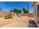 Relax in this xeriscaped backyard with a fire pit surrounded by Adirondack chairs at 17401 N 16Th Ave, Phoenix, AZ 85023