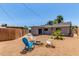 Enjoy this xeriscaped backyard with a fire pit, plenty of seating, and an easy access patio at 17401 N 16Th Ave, Phoenix, AZ 85023