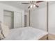 Bedroom featuring white walls and ceiling fan, closet, and a door with natural light at 17401 N 16Th Ave, Phoenix, AZ 85023