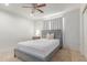 Bedroom with wooden bed frame, white walls, and ceiling fan is simple and cozy at 17401 N 16Th Ave, Phoenix, AZ 85023