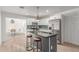 Modern kitchen with stainless steel appliances, white cabinetry, and an island with barstools at 17401 N 16Th Ave, Phoenix, AZ 85023