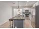 Modern kitchen with stainless appliances, granite counters, white cabinets and kitchen island with seating at 17401 N 16Th Ave, Phoenix, AZ 85023