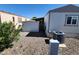 Exterior shot displaying gravel landscaping and a storage unit with residential features at 18026 N Cave Creek Rd # 16, Phoenix, AZ 85032