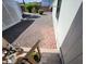 The backyard has desert landscaping, decorative rocks, and a paved walkway, accessible via a small set of stairs at 18026 N Cave Creek Rd # 16, Phoenix, AZ 85032