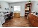 Bedroom/office featuring hardwood floors, closet, lots of natural light, with desk and office furnishings at 18026 N Cave Creek Rd # 16, Phoenix, AZ 85032