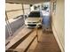 Carport view with white vehicle parked beneath and a wheelchair ramp for accessible entry at 18026 N Cave Creek Rd # 16, Phoenix, AZ 85032