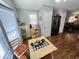 The dining area adjacent to the kitchen has matching appliances, wood floors, and bright natural light at 18026 N Cave Creek Rd # 16, Phoenix, AZ 85032