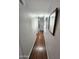 Hallway featuring hardwood floors, neutral paint, and lots of natural light at 18026 N Cave Creek Rd # 16, Phoenix, AZ 85032