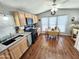 An eat-in kitchen has wood cabinets, modern appliances, stone countertops, and updated lighting and fixtures at 18026 N Cave Creek Rd # 16, Phoenix, AZ 85032