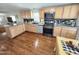Well-lit kitchen featuring stainless steel appliances, granite countertops, with ample cabinets for storage at 18026 N Cave Creek Rd # 16, Phoenix, AZ 85032