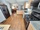 Well-lit kitchen featuring stainless steel appliances, and granite countertops offers seamless flow into the living area at 18026 N Cave Creek Rd # 16, Phoenix, AZ 85032