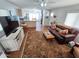 Open concept living room and kitchen with hardwood floors, comfortable leather furniture, and lots of natural light at 18026 N Cave Creek Rd # 16, Phoenix, AZ 85032