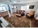 Comfortable living room with hardwood floors, comfortable leather furniture, and lots of natural light at 18026 N Cave Creek Rd # 16, Phoenix, AZ 85032