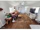 A warm living room features wood floors, neutral paint, comfortable seating, and a flat screen television at 18026 N Cave Creek Rd # 16, Phoenix, AZ 85032