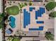 Aerial view of a home featuring solar panels, pool, gazebo, and artificial turf at 18207 W Sells Dr, Goodyear, AZ 85395