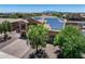 Aerial view of home featuring solar panels, front yard landscaping, and a circular driveway at 18207 W Sells Dr, Goodyear, AZ 85395