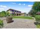 Expansive backyard featuring well-manicured lawn, large swimming pool, and lush greenery at 18207 W Sells Dr, Goodyear, AZ 85395