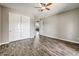 Bedroom with wood-look floors and a closet for storage at 18207 W Sells Dr, Goodyear, AZ 85395