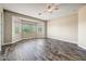 Large bedroom with wood-look floors and bright windows at 18207 W Sells Dr, Goodyear, AZ 85395