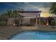 Relaxing cabana next to the pool with a sitting area, perfect for outdoor entertainment at 18207 W Sells Dr, Goodyear, AZ 85395