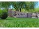 View of the Sedella community sign framed with lush landscaping and green grass at 18207 W Sells Dr, Goodyear, AZ 85395
