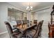 Formal dining area featuring a chandelier and a view of the entryway at 18207 W Sells Dr, Goodyear, AZ 85395