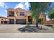 Beautiful two-story home with a three-car garage, balcony, and desert-friendly landscaping at 18207 W Sells Dr, Goodyear, AZ 85395