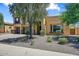 Inviting two-story home with a three-car garage and desert landscaping at 18207 W Sells Dr, Goodyear, AZ 85395