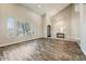 Bright living room boasts abundant natural light and wood-look floors at 18207 W Sells Dr, Goodyear, AZ 85395