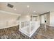 Bright loft area with stylish wood-look floors and white railings at 18207 W Sells Dr, Goodyear, AZ 85395