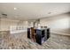 Upstairs loft area featuring an island desk with seating at 18207 W Sells Dr, Goodyear, AZ 85395