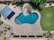 Aerial view of backyard oasis with pool, rock waterfall, gazebo, and putting green at 18207 W Sells Dr, Goodyear, AZ 85395