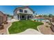 Large grassy backyard featuring a pool with secure iron fencing at 1847 W Leah Ln, Gilbert, AZ 85233