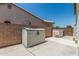 Practical backyard featuring storage sheds, a privacy wall, and a well-kept concrete area at 1847 W Leah Ln, Gilbert, AZ 85233