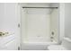 This is a bathroom with a white tiled shower and tub at 1847 W Leah Ln, Gilbert, AZ 85233