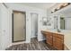 This bathroom has a walk in shower and single sink vanity at 1847 W Leah Ln, Gilbert, AZ 85233