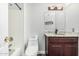 This is a bathroom with a vanity, mirror, toilet, and shower at 1847 W Leah Ln, Gilbert, AZ 85233