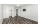 This is a bedroom with hardwood floors and white walls at 1847 W Leah Ln, Gilbert, AZ 85233