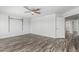 This bedroom features hard surface flooring and an open door to the closet at 1847 W Leah Ln, Gilbert, AZ 85233