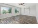 This bedroom has hard surface flooring and a ceiling fan at 1847 W Leah Ln, Gilbert, AZ 85233