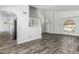 Inviting foyer featuring wood-look tile flooring, staircase, and abundant natural light at 1847 W Leah Ln, Gilbert, AZ 85233